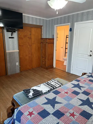 a bathroom with a double vanity sink a mirror and a toilet