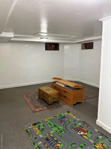 a bedroom with a bed and cabinets