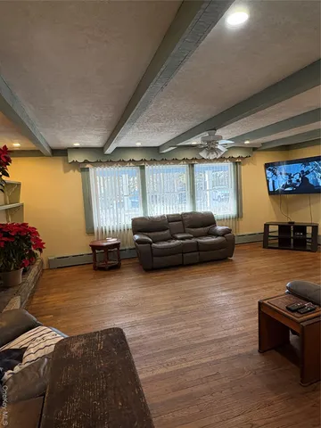 a living room with furniture and a window