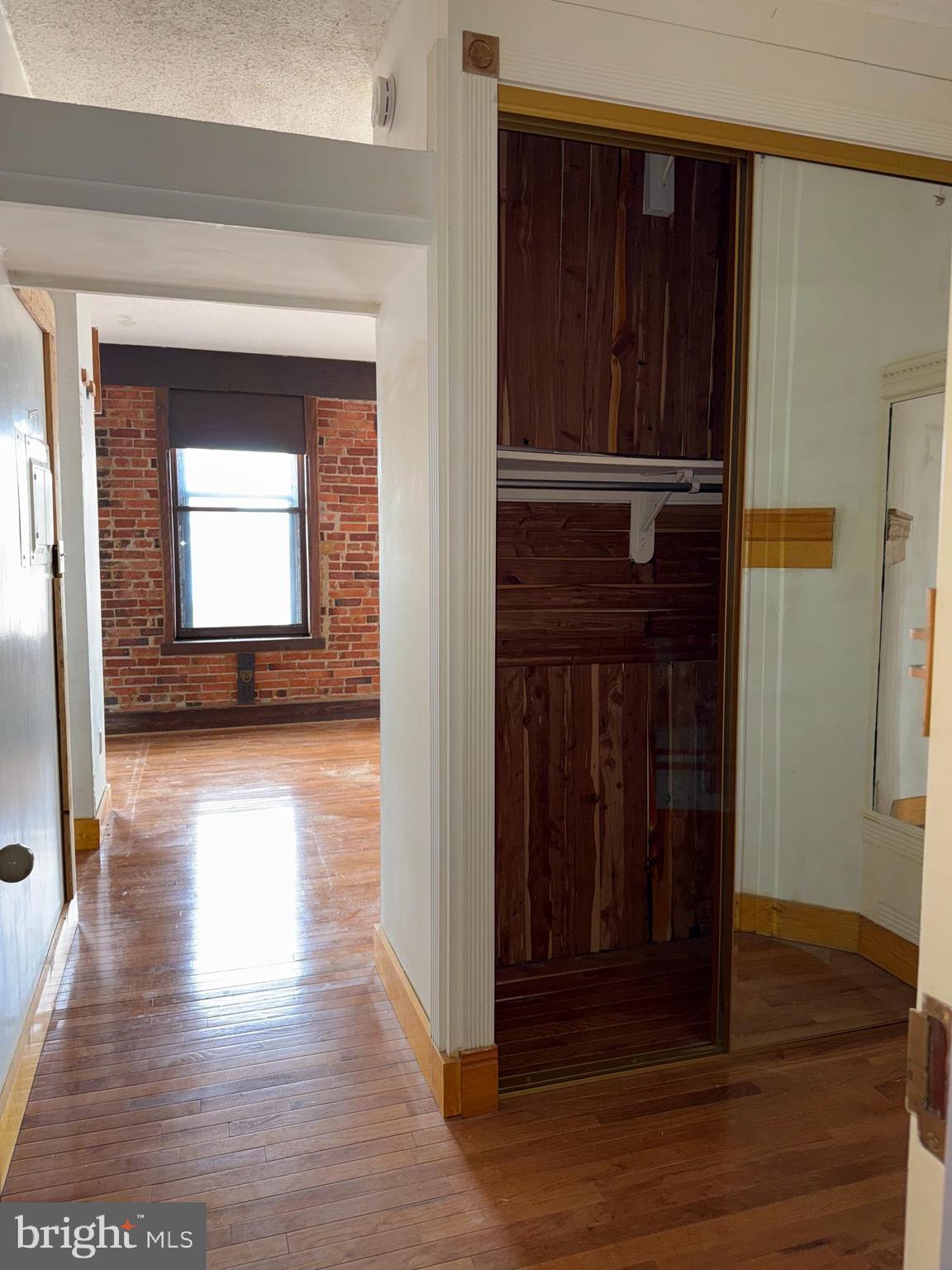 1615 Q Street Northwest, Unit 509 Washington, DC 20009 - Photo 9 of 16 a view of a hallway with wooden floor and staircase