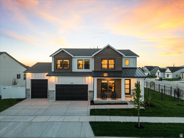 2458 West Aurora Avenue, Unit 287 Mapleton, UT 84664 - Photo 2 of 24 Modern farmhouse style home featuring covered porch, board and batten siding, driveway, and a metal roof