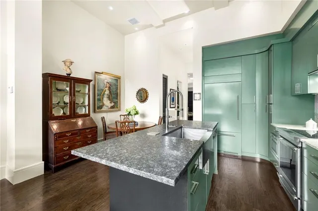a living room with furniture a flat screen tv and a large window