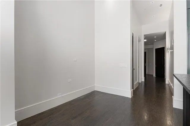 a view of an entryway with wooden floor