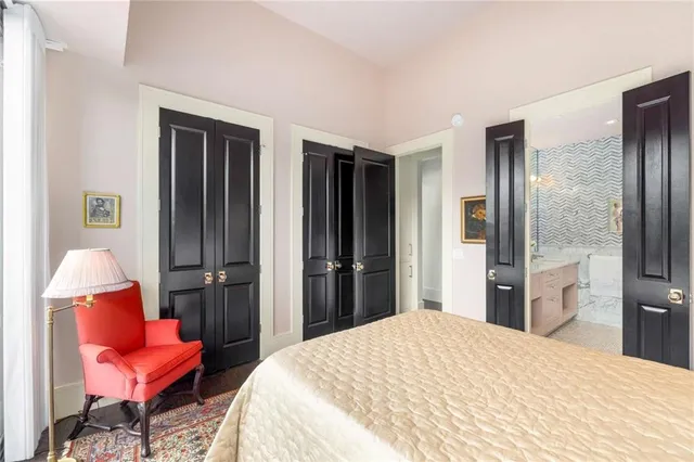 a bedroom with furniture and a book shelf