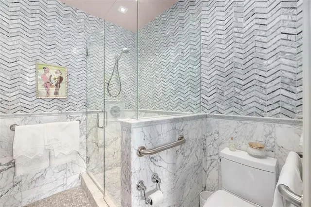 a view of a patio with chairs and plants