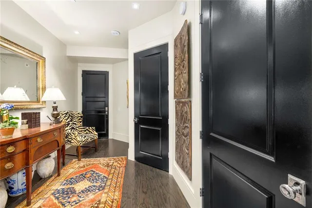 a kitchen with stainless steel appliances granite countertop a sink and a refrigerator