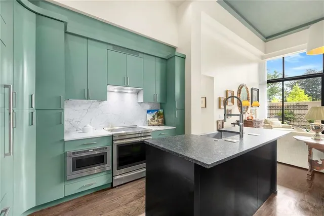 a kitchen with sink and refrigerator