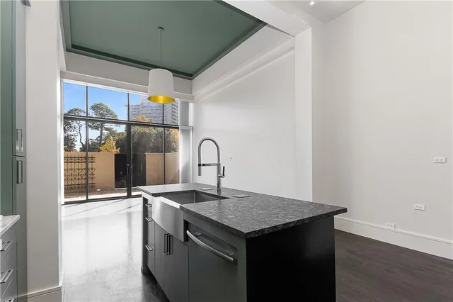 a kitchen with a sink cabinets and a stove
