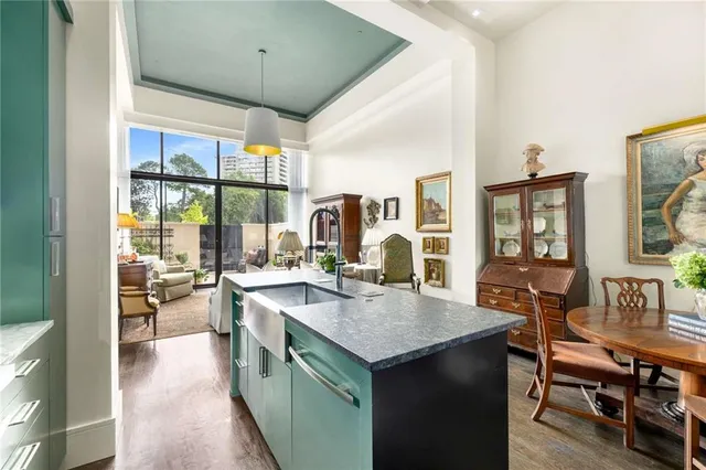 a dining room with furniture and wooden floor