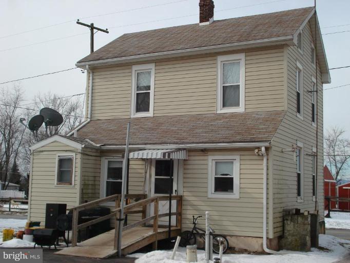 5059 Harney Road Taneytown, MD 21787 - Photo 2 of 4 a front view of a house with many windows