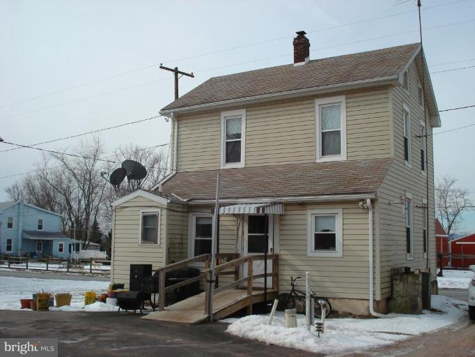 5059 Harney Road Taneytown, MD 21787 - Photo 4 of 4 a front view of a house with a street
