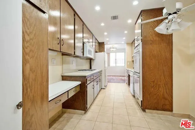 a bathroom with a sink a mirror and a shower