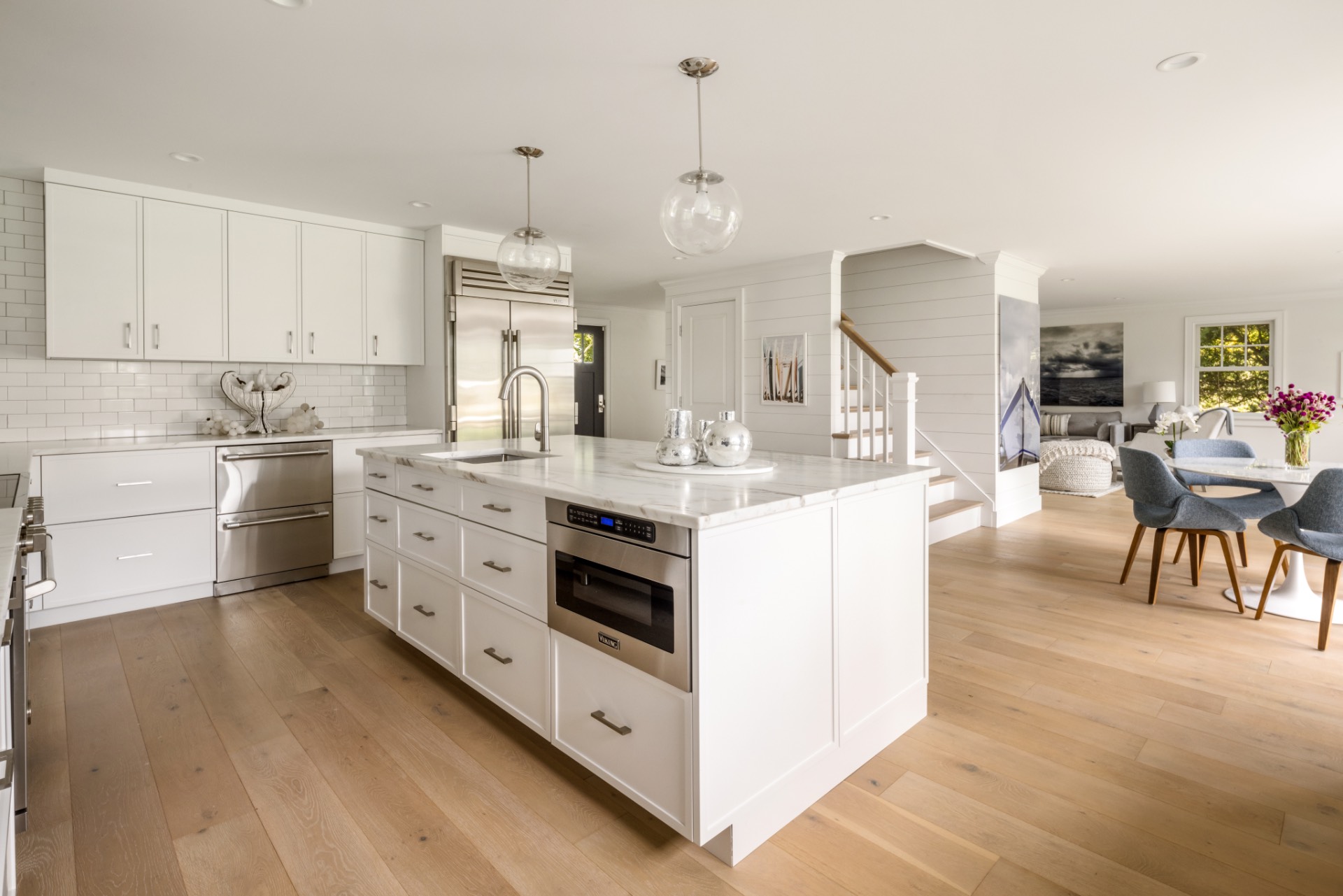 30 Cobb Isle Road Water Mill, NY 11976 - Photo 4 of 10 a kitchen that has a lot of white cabinets and stainless steel appliances