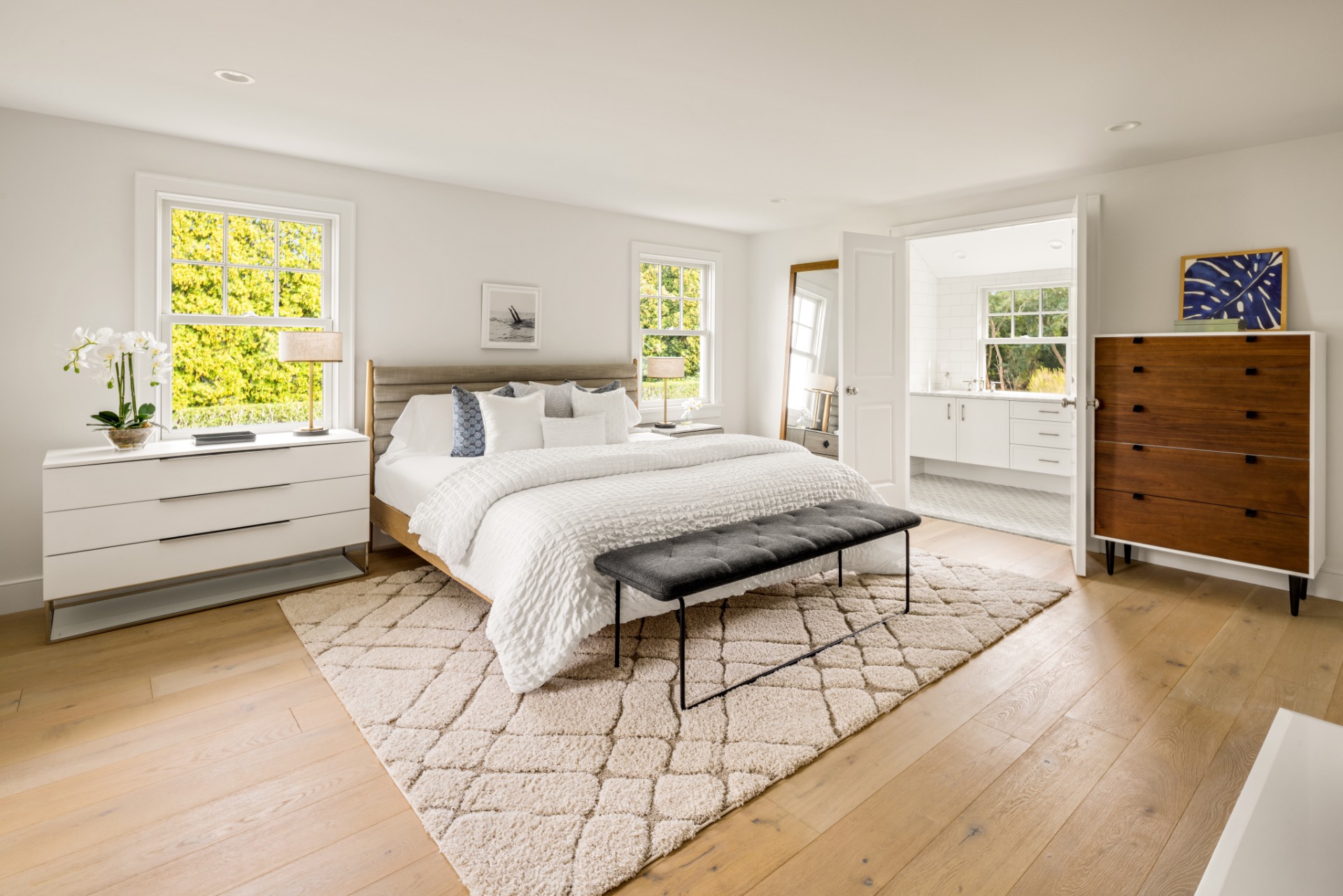 30 Cobb Isle Road Water Mill, NY 11976 - Photo 8 of 10 a spacious bedroom with a bed and a dresser