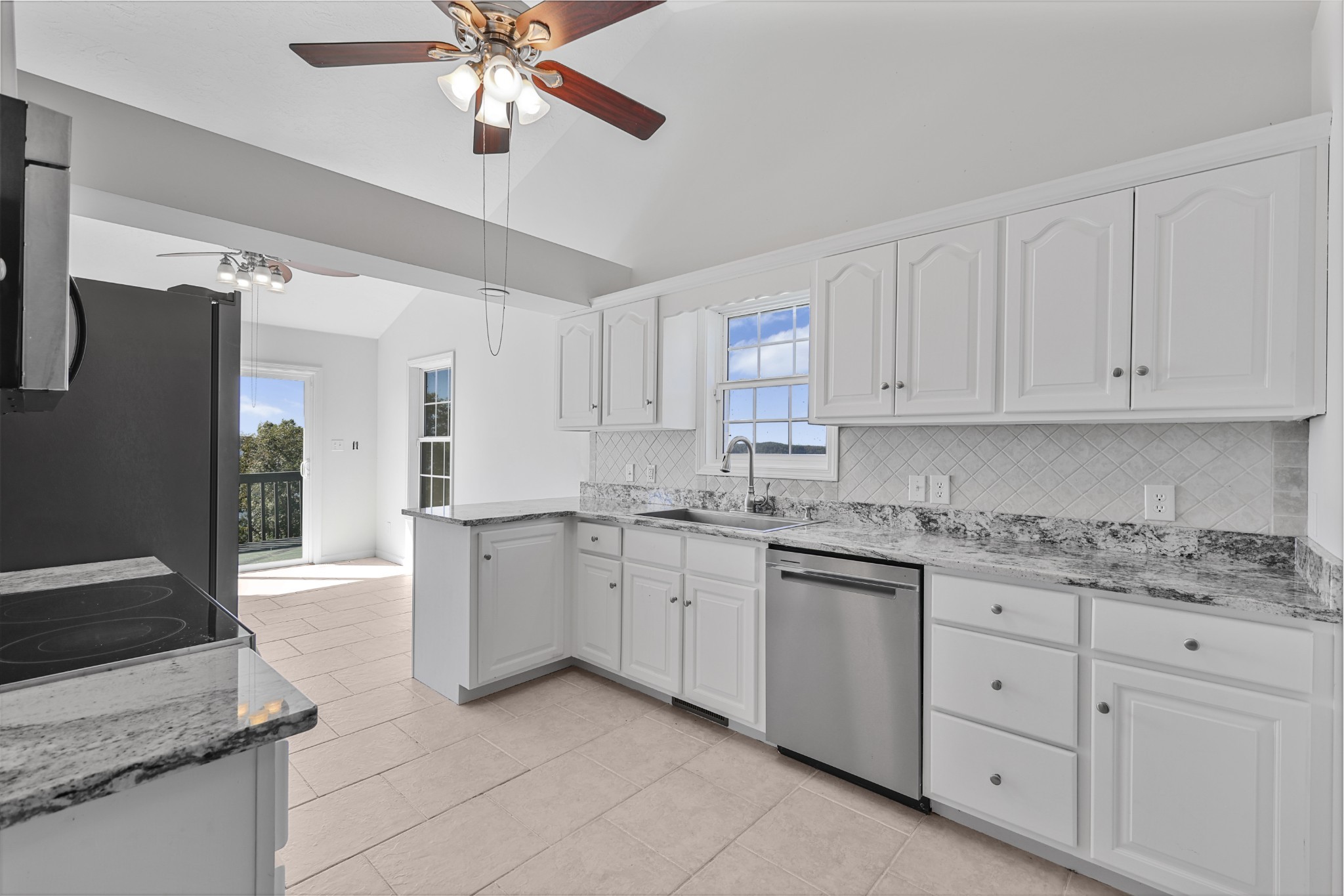 185 Sunset Pass Big Sandy, TN 38221 - Photo 12 of 52 a kitchen with a sink stove and cabinets