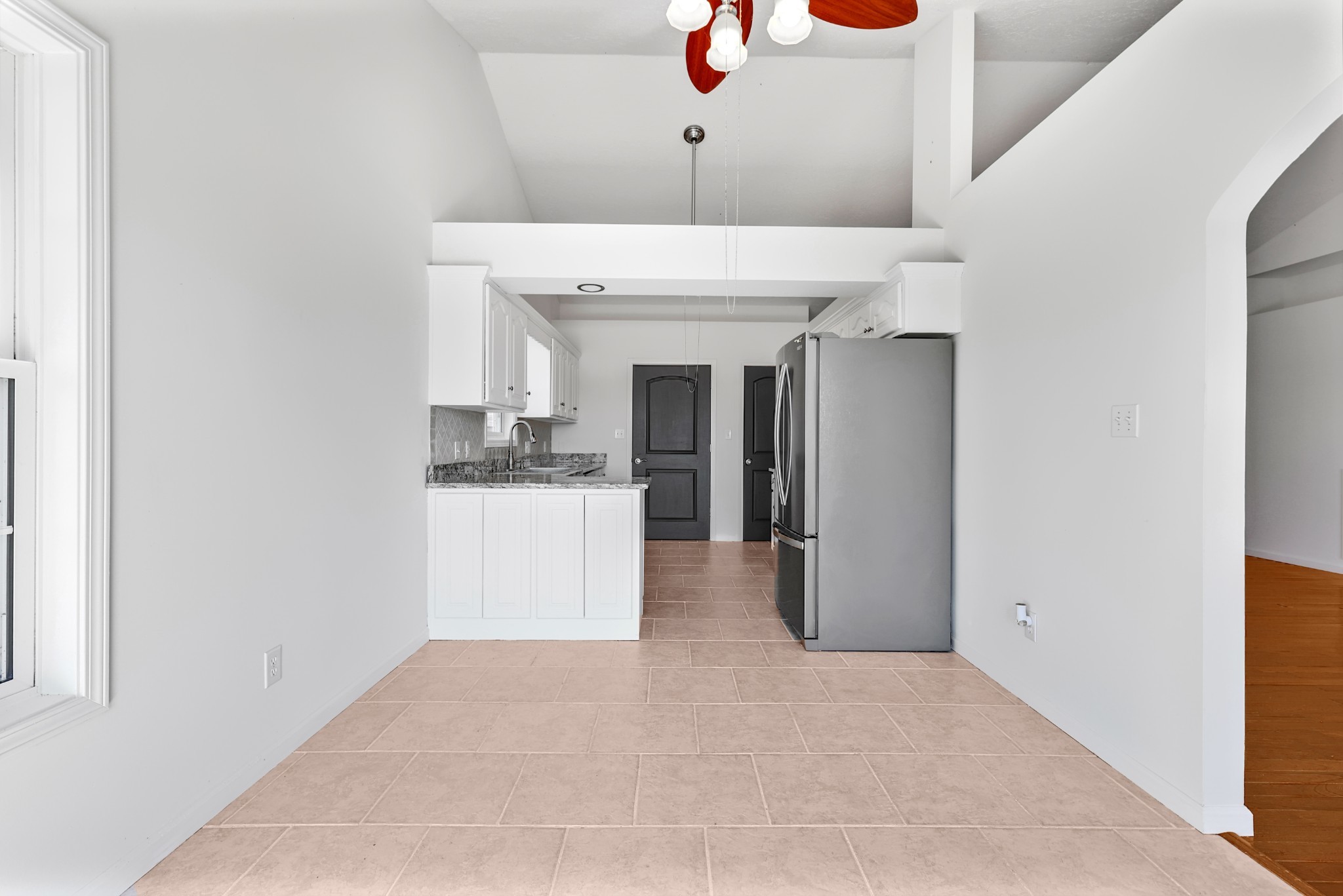 185 Sunset Pass Big Sandy, TN 38221 - Photo 15 of 52 a view of a kitchen with furniture and a window