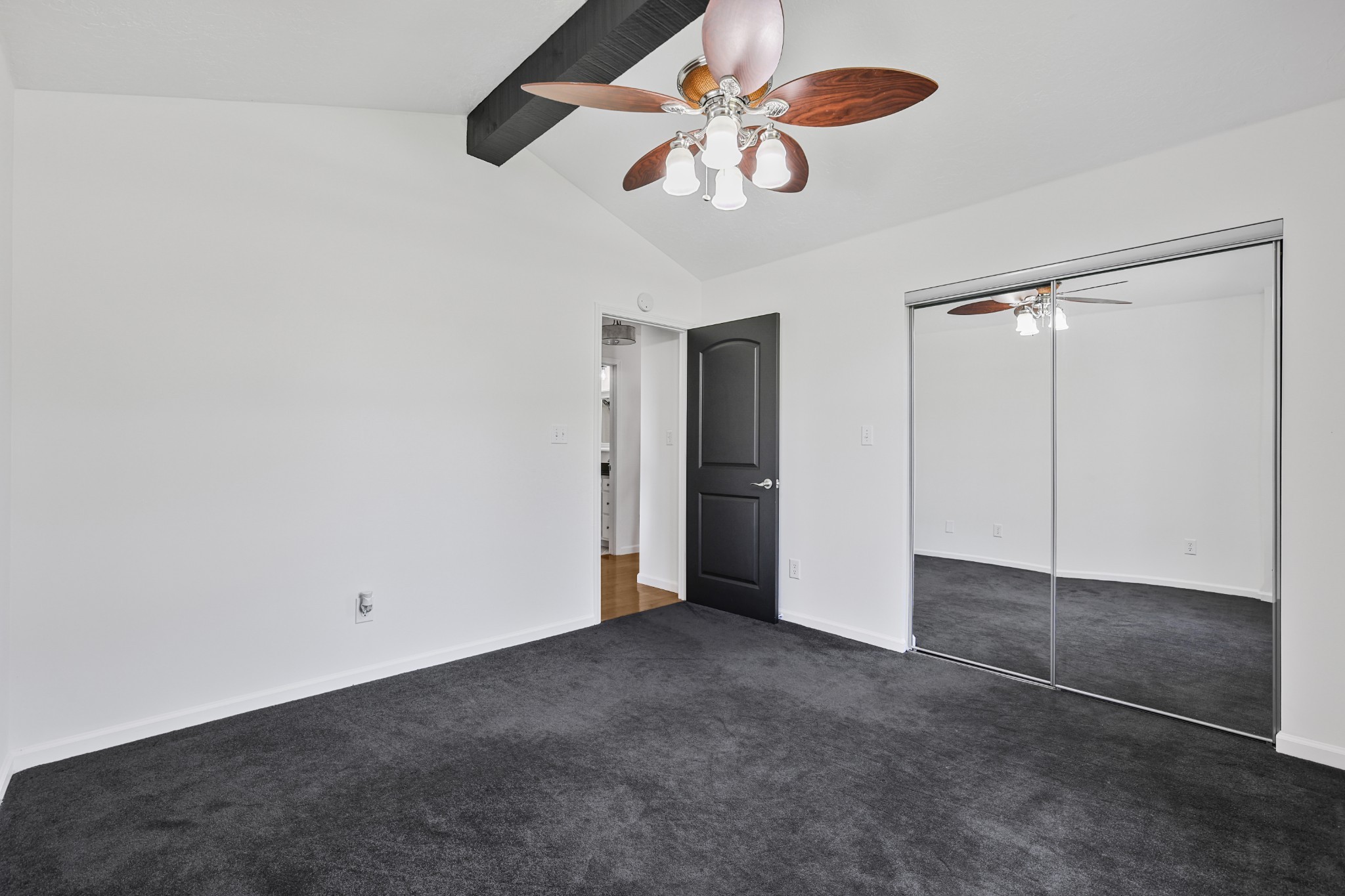 185 Sunset Pass Big Sandy, TN 38221 - Photo 18 of 52 an empty room with closet and a chandelier fan