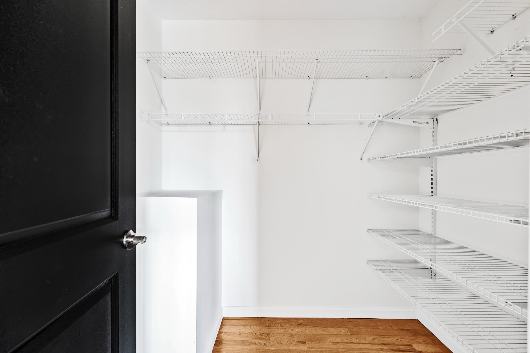 185 Sunset Pass Big Sandy, TN 38221 - Photo 23 of 52 a view of walk in closet with empty racks
