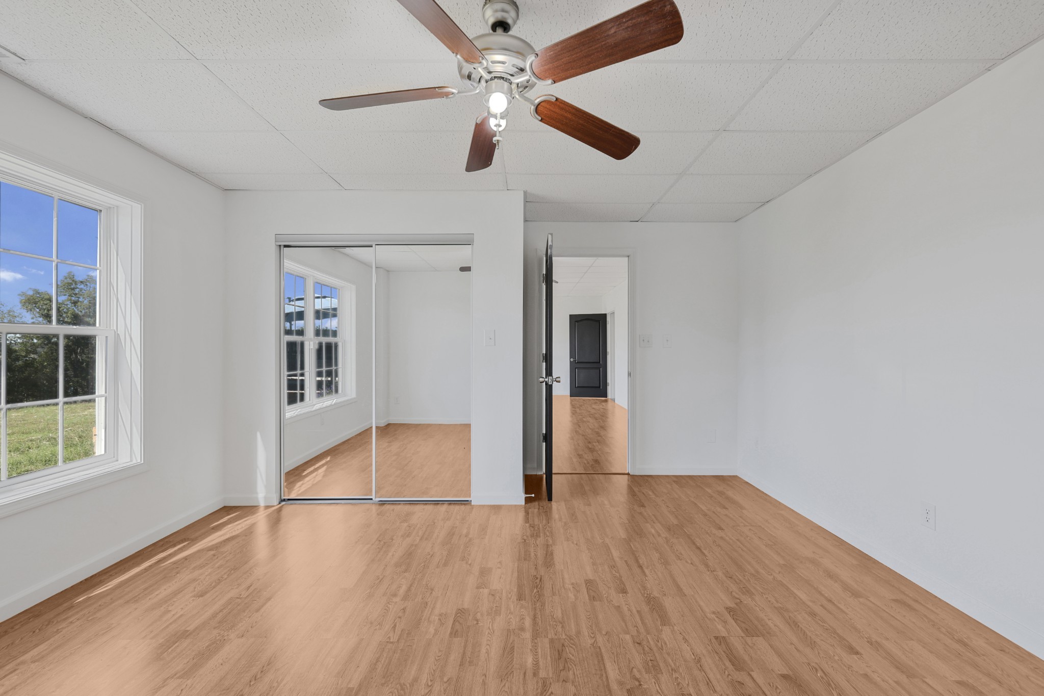 185 Sunset Pass Big Sandy, TN 38221 - Photo 28 of 52 a view of empty room with wooden floor and fan