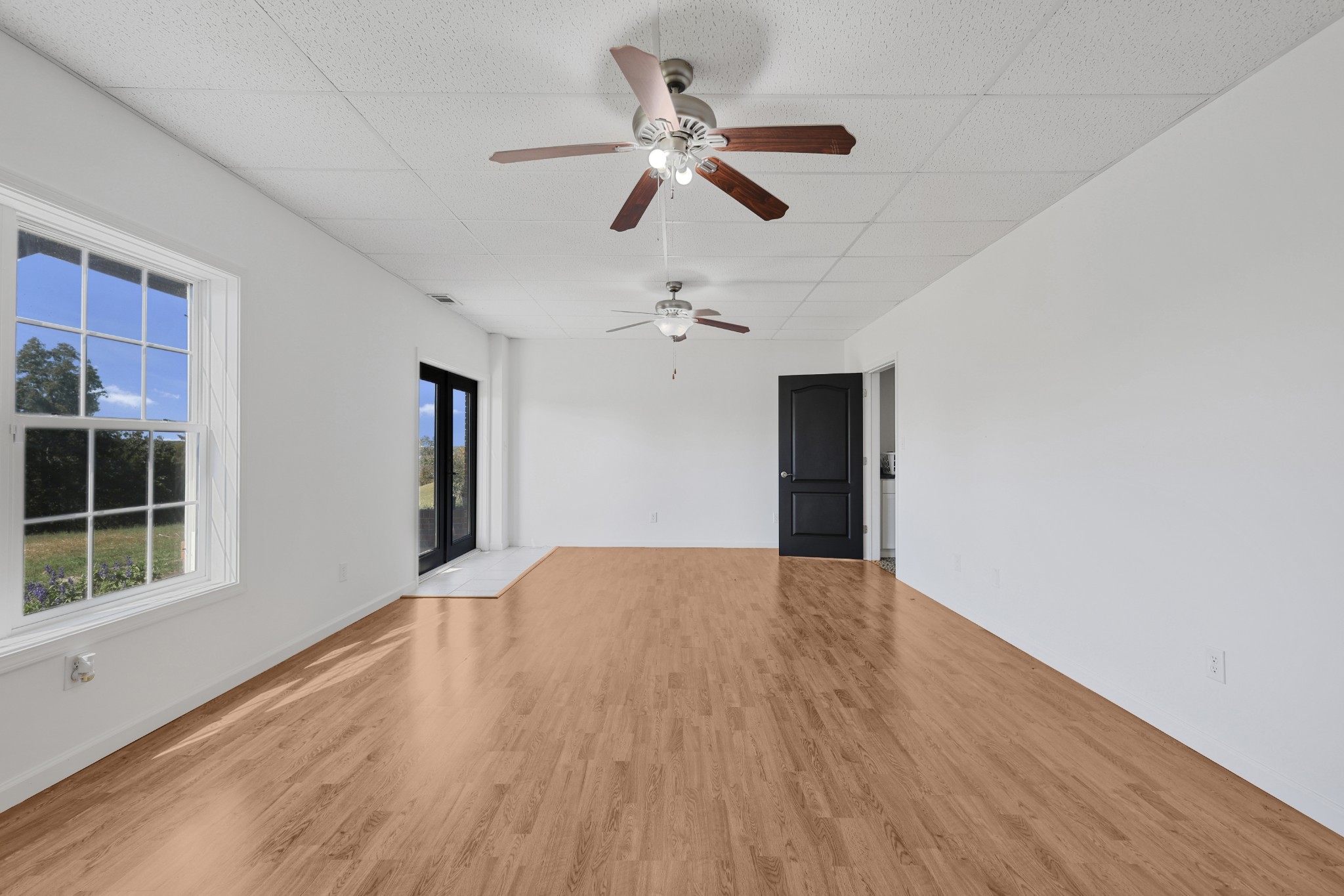 185 Sunset Pass Big Sandy, TN 38221 - Photo 33 of 52 wooden floor in an empty room with a window
