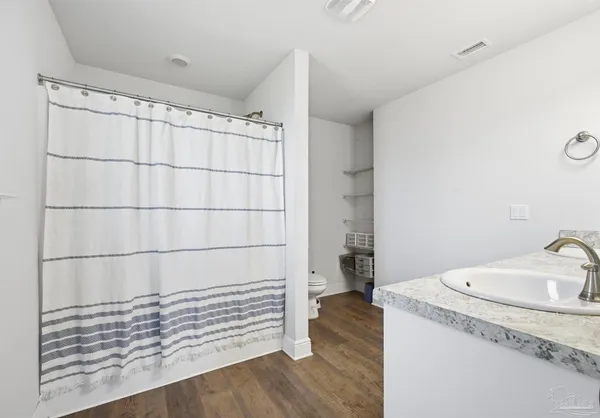 a bathroom with a sink and shower