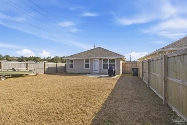 a house with yard in front of it