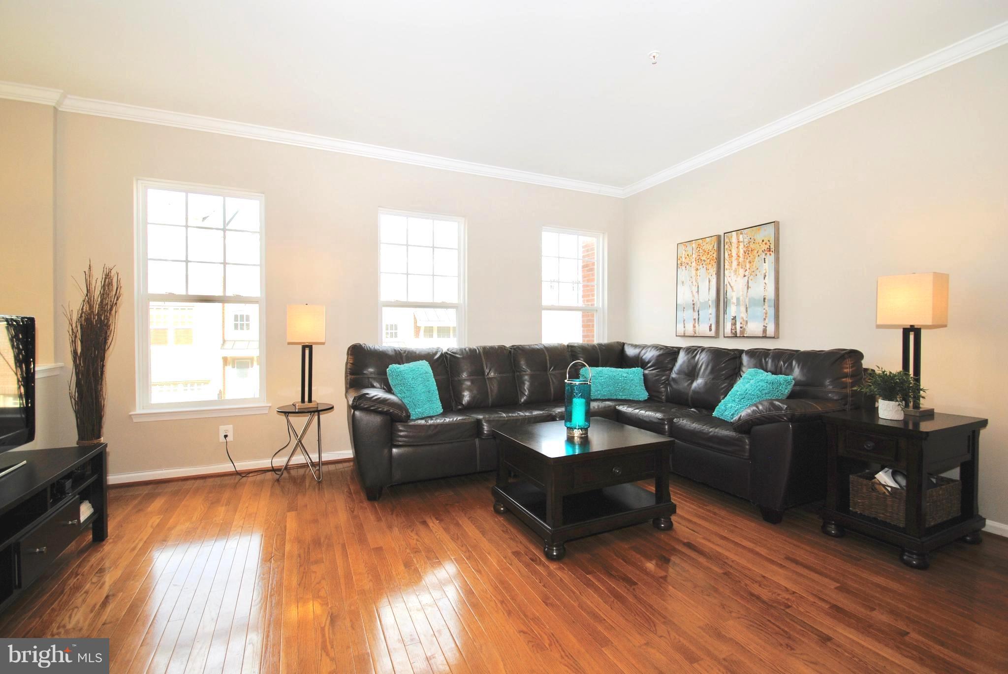 2707 Amber Crest Road Hanover, MD 21076 - Photo 2 of 30 a living room with furniture and a flat screen tv