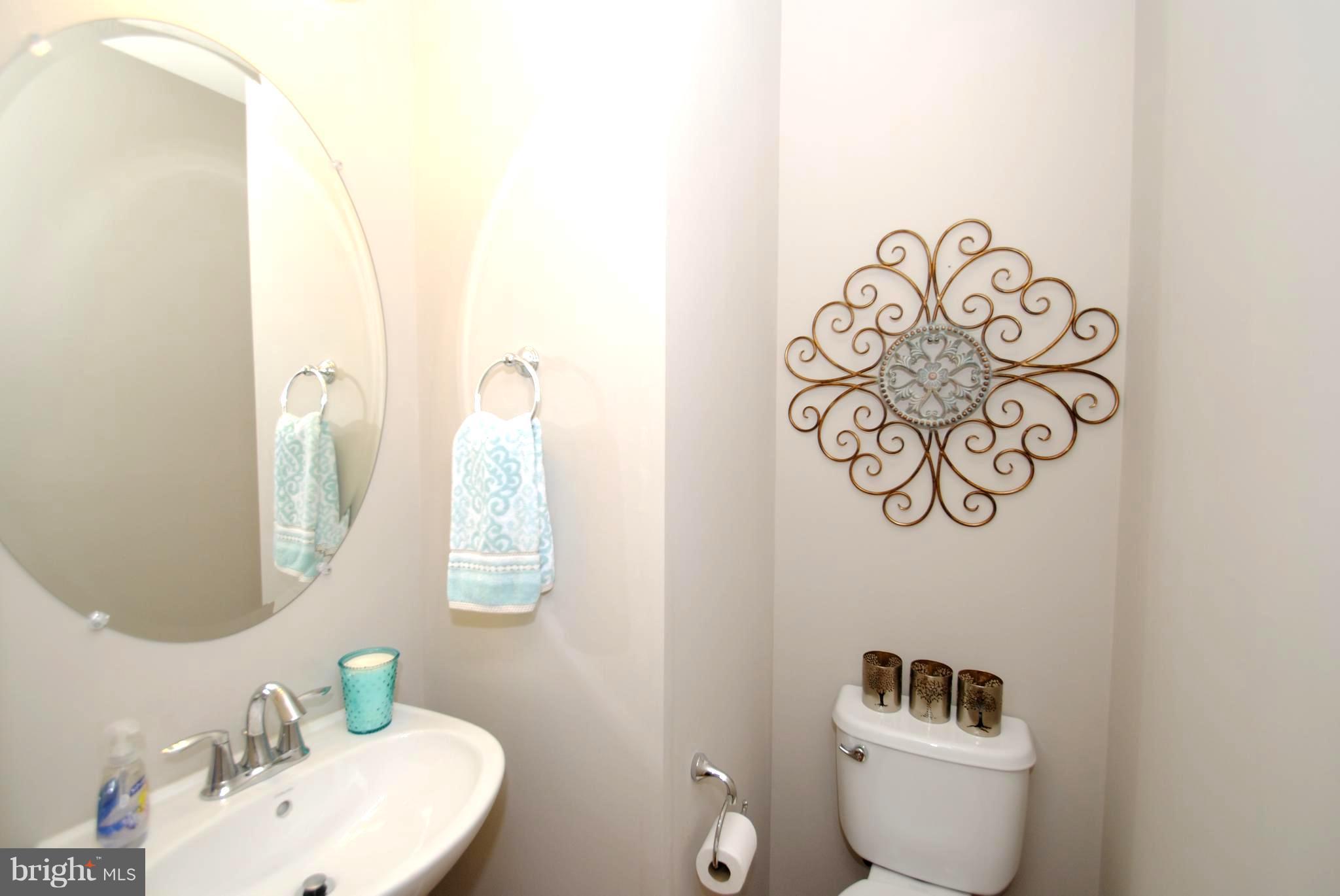 2707 Amber Crest Road Hanover, MD 21076 - Photo 11 of 30 a bathroom with a toilet sink and mirror