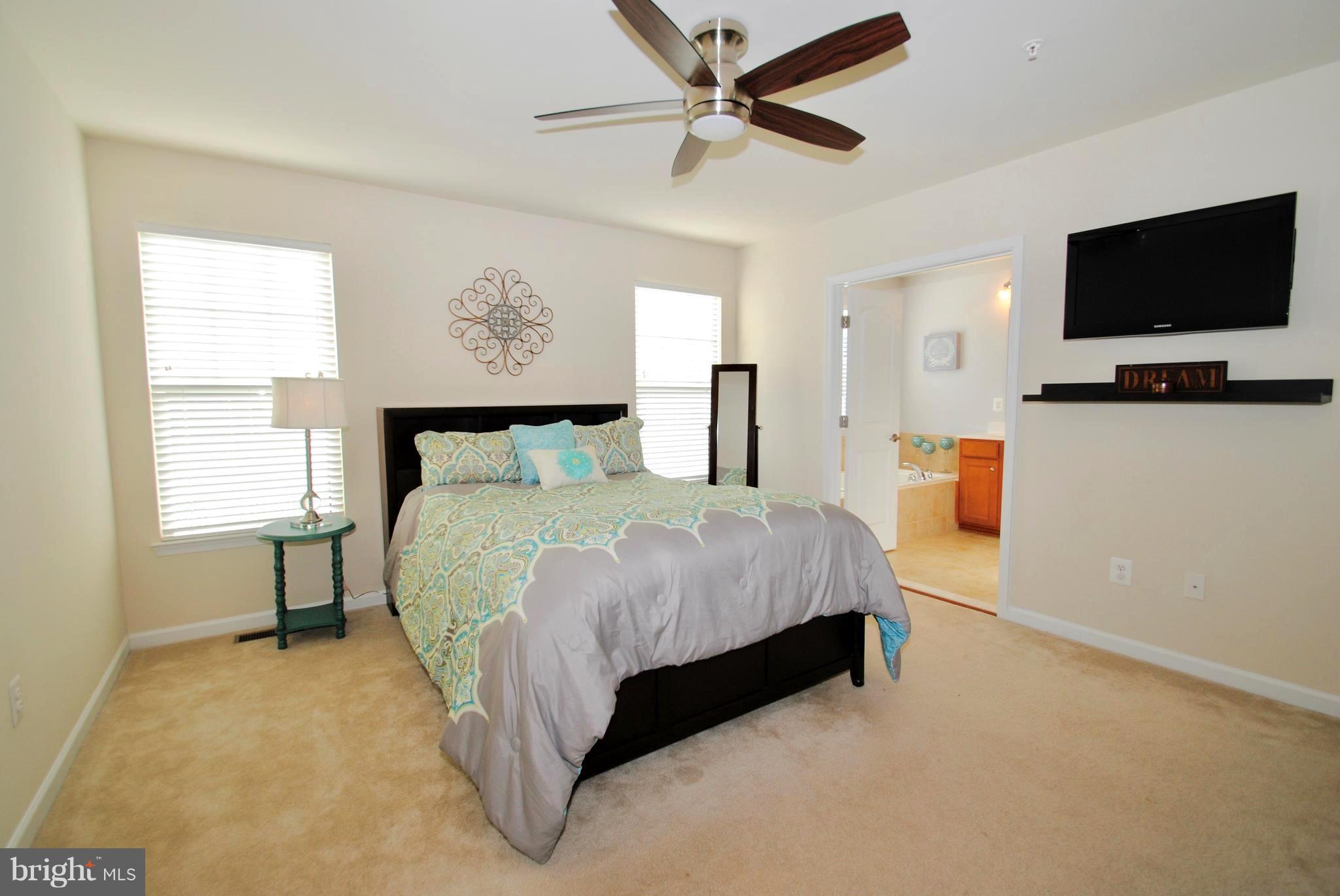 2707 Amber Crest Road Hanover, MD 21076 - Photo 12 of 30 a bedroom with a bed tv and window