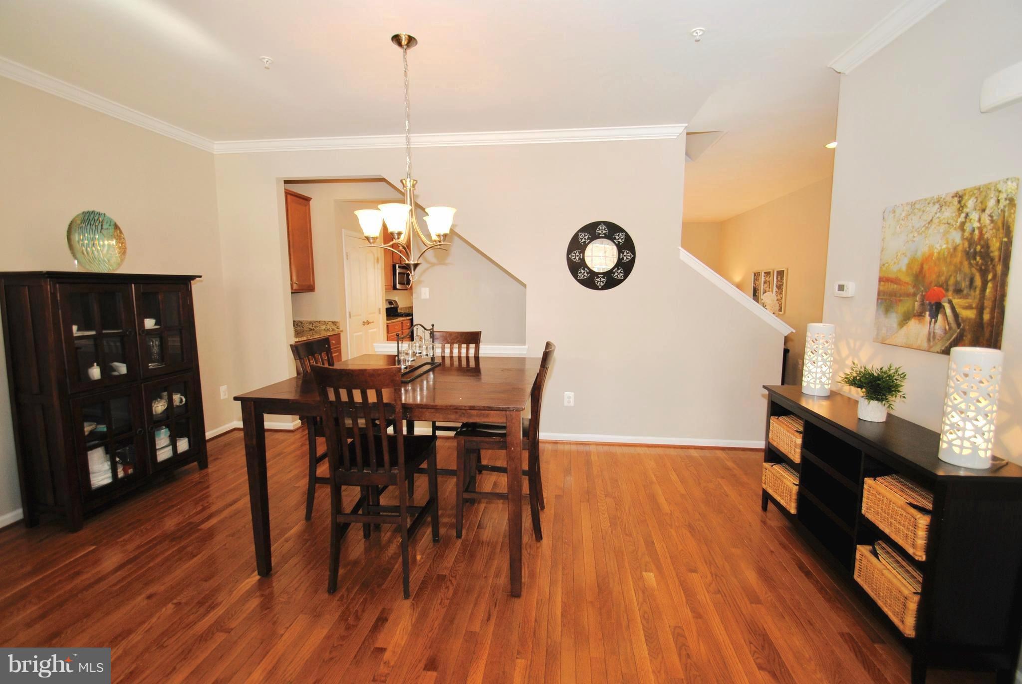 2707 Amber Crest Road Hanover, MD 21076 - Photo 29 of 30 a view of a dining room with furniture and wooden floor