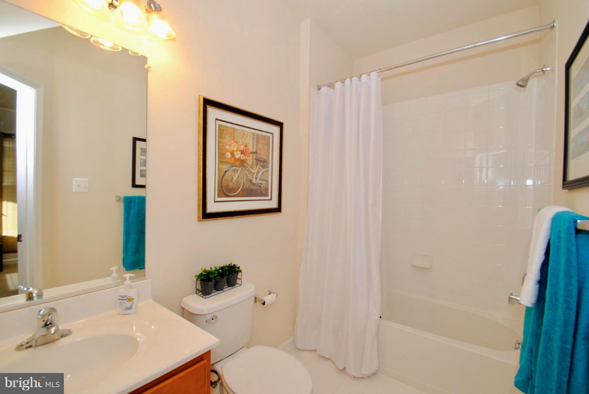 2707 Amber Crest Road Hanover, MD 21076 - Photo 25 of 30 a bathroom with a sink toilet and shower