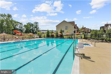 2707 Amber Crest Road Hanover, MD 21076 - Photo 27 of 30 a view of a house with swimming pool and sitting area