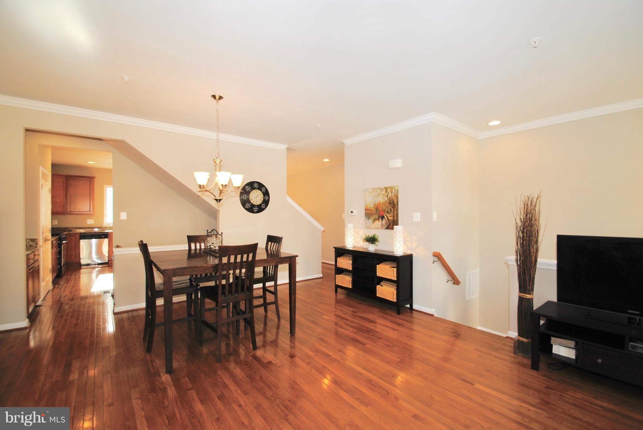 2707 Amber Crest Road Hanover, MD 21076 - Photo 30 of 30 a view of a dining room with furniture and wooden floor