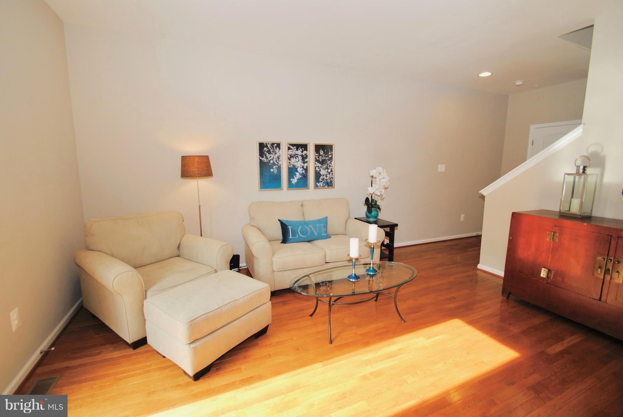 2707 Amber Crest Road Hanover, MD 21076 - Photo 7 of 30 a living room with furniture and wooden floor