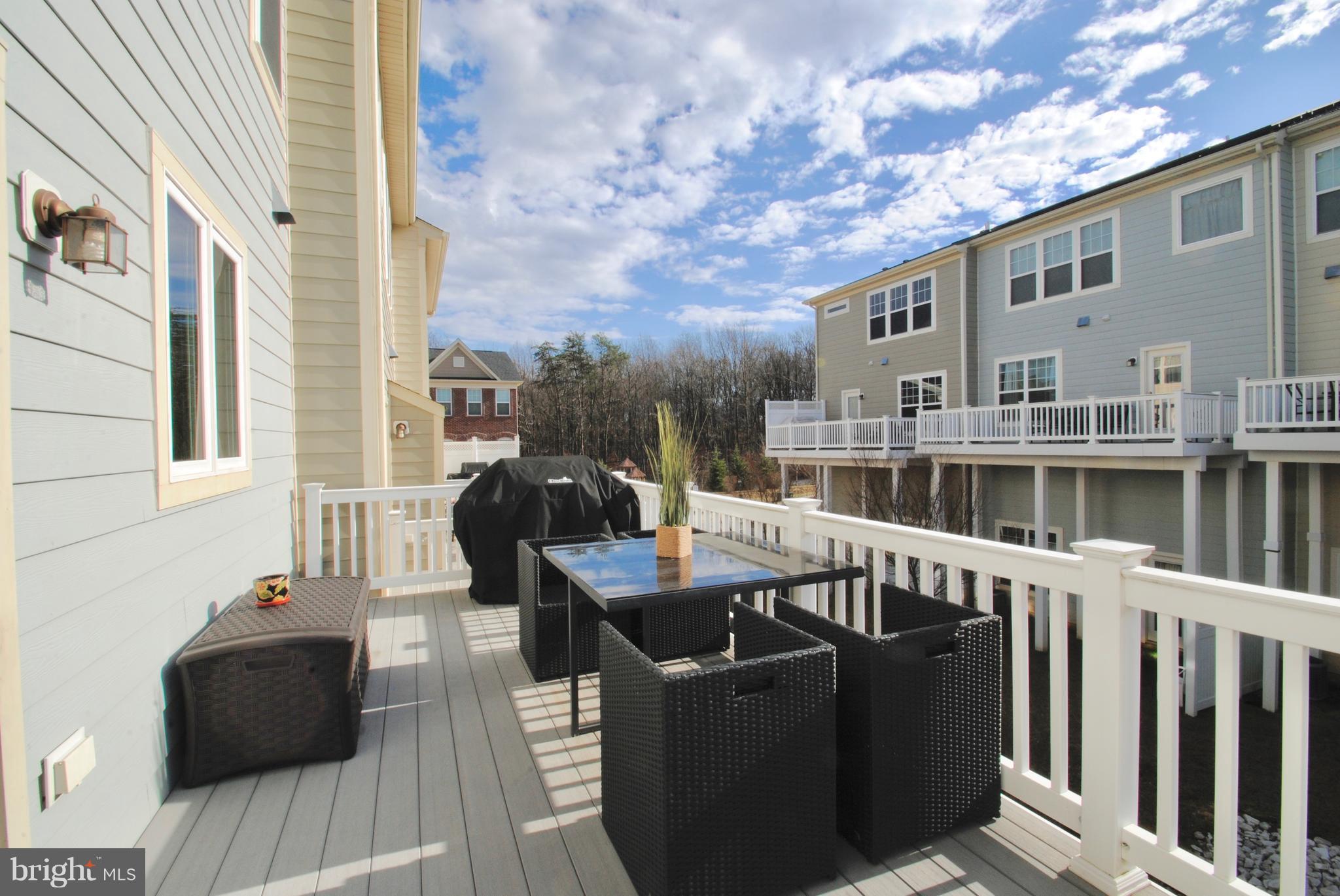 2707 Amber Crest Road Hanover, MD 21076 - Photo 8 of 30 a balcony with furniture and wooden floor