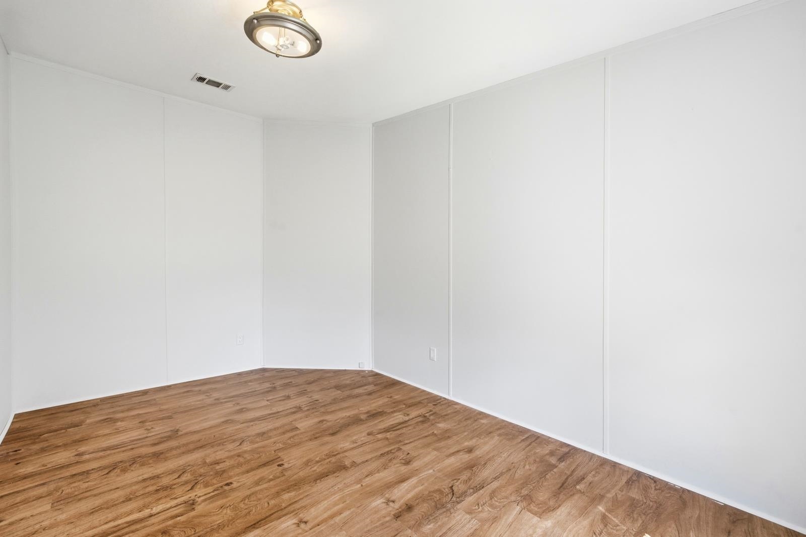 299 Cayenne Street Interlachen, FL 32148 - Photo 27 of 73 Unfurnished room with wood finished floors