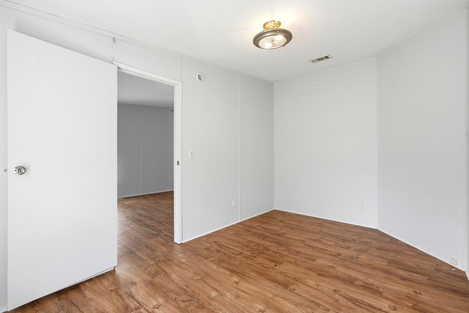 299 Cayenne Street Interlachen, FL 32148 - Photo 28 of 73 Spare room with wood finished floors