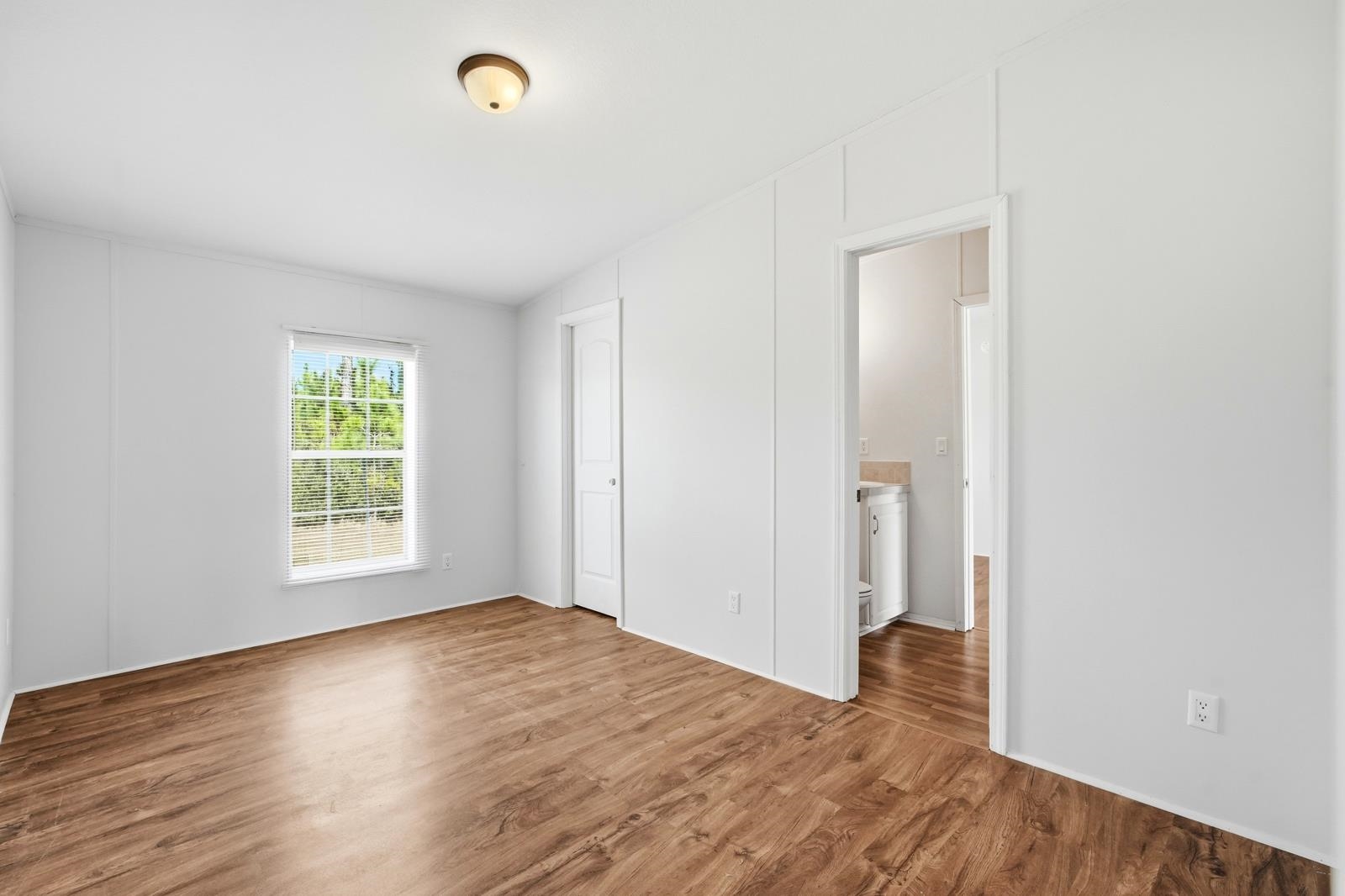 299 Cayenne Street Interlachen, FL 32148 - Photo 29 of 73 Unfurnished bedroom featuring wood finished floors