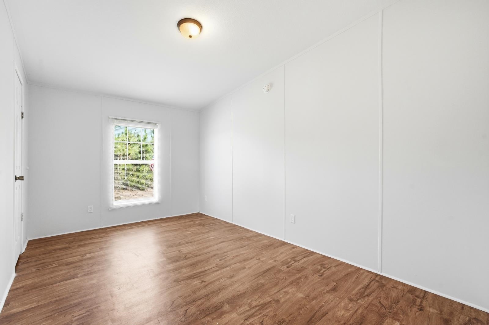 299 Cayenne Street Interlachen, FL 32148 - Photo 30 of 73 Unfurnished room featuring wood finished floors