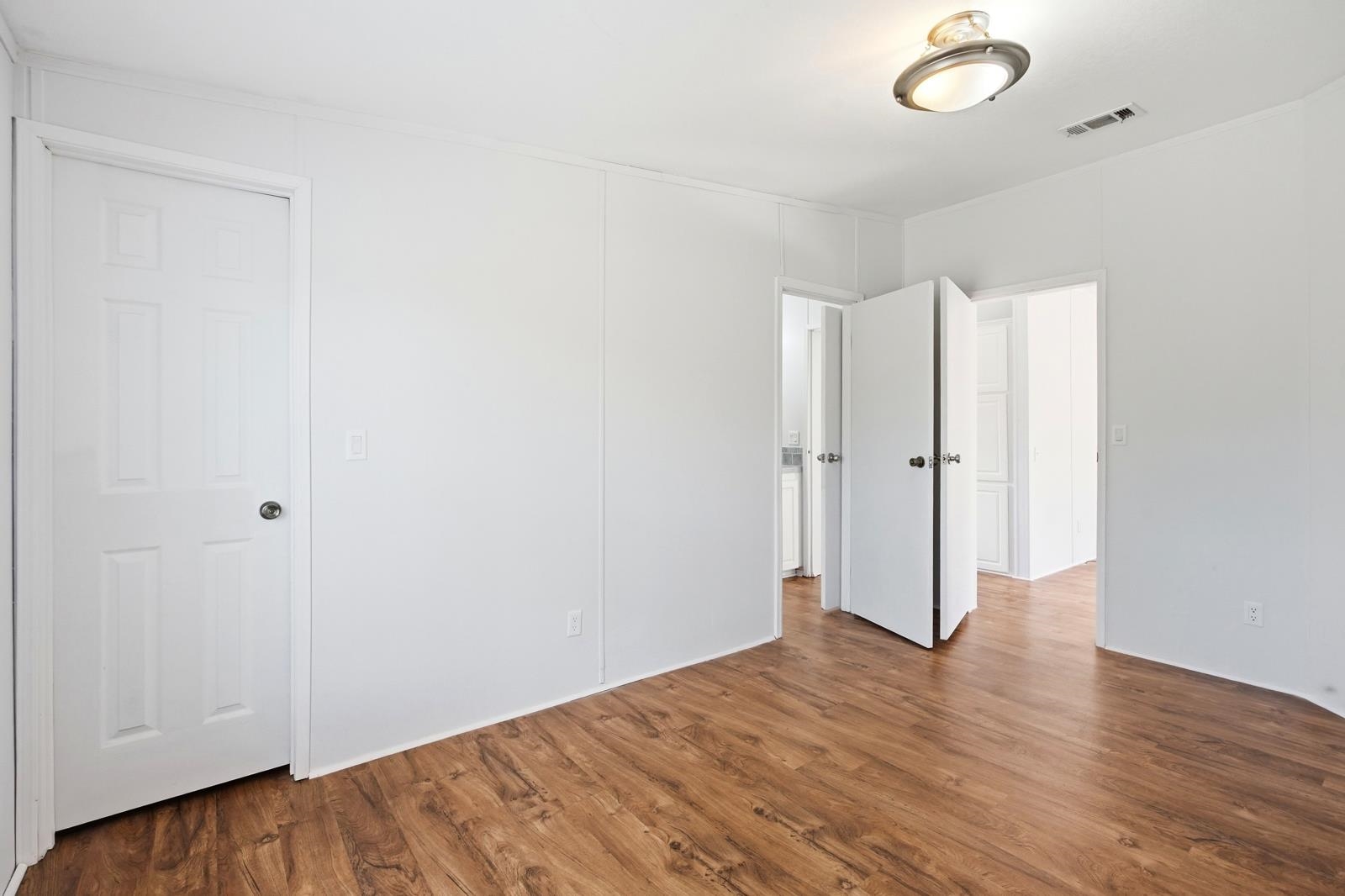 299 Cayenne Street Interlachen, FL 32148 - Photo 35 of 73 Unfurnished bedroom featuring wood finished floors
