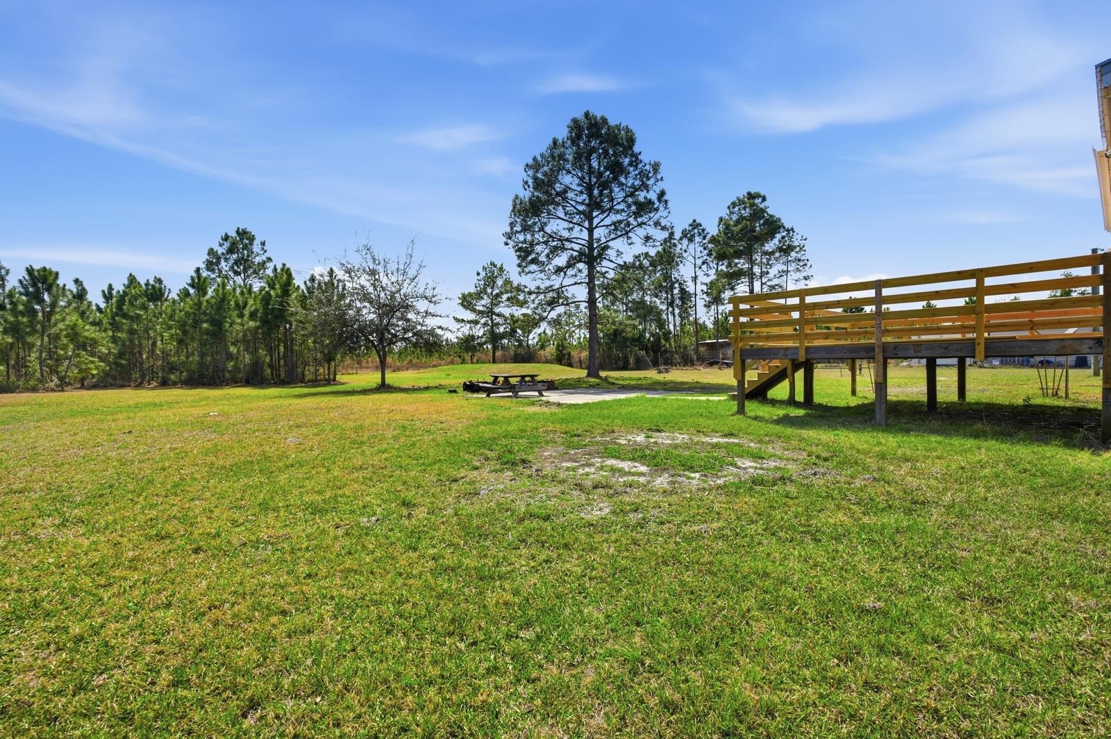 299 Cayenne Street Interlachen, FL 32148 - Photo 43 of 73 View of grassy yard with a patio