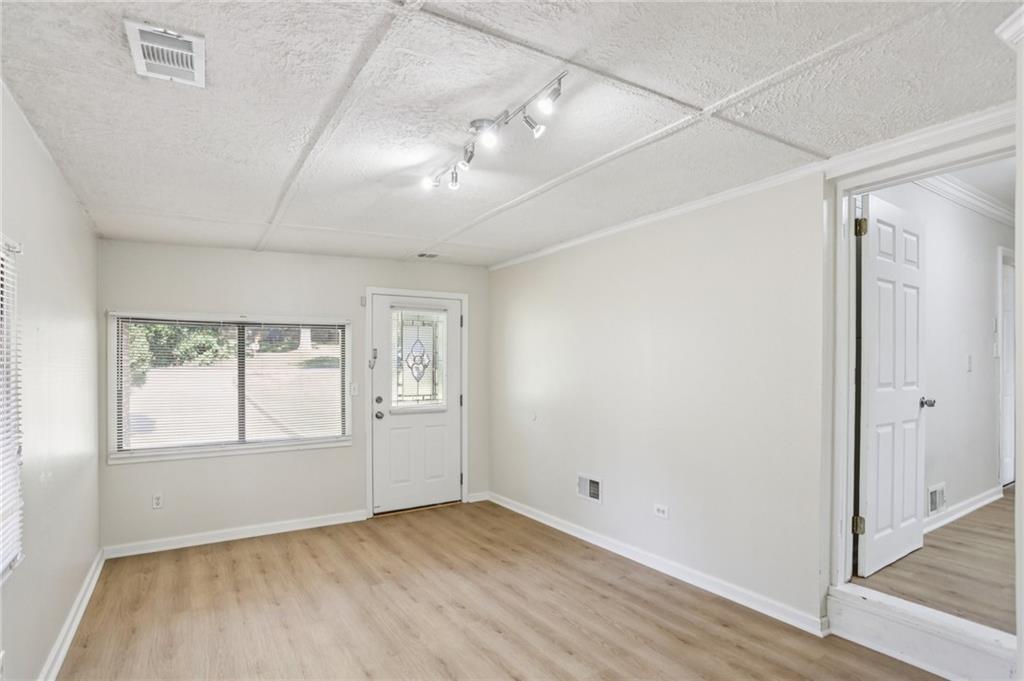 2370 Beaver Creek Road Smyrna, GA 30080 - Photo 18 of 23 a view of an empty room with wooden floor and a window