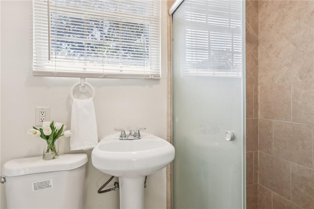 2370 Beaver Creek Road Smyrna, GA 30080 - Photo 19 of 23 a bathroom with a sink a mirror and a window