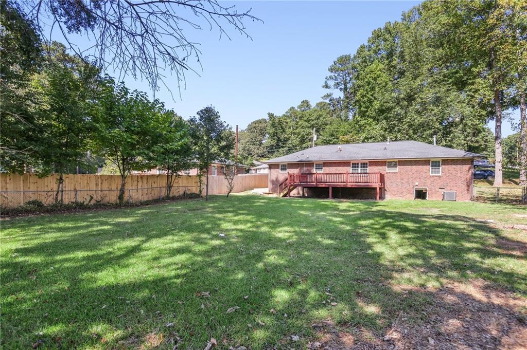 2370 Beaver Creek Road Smyrna, GA 30080 - Photo 20 of 23 a backyard of a house with table and chairs