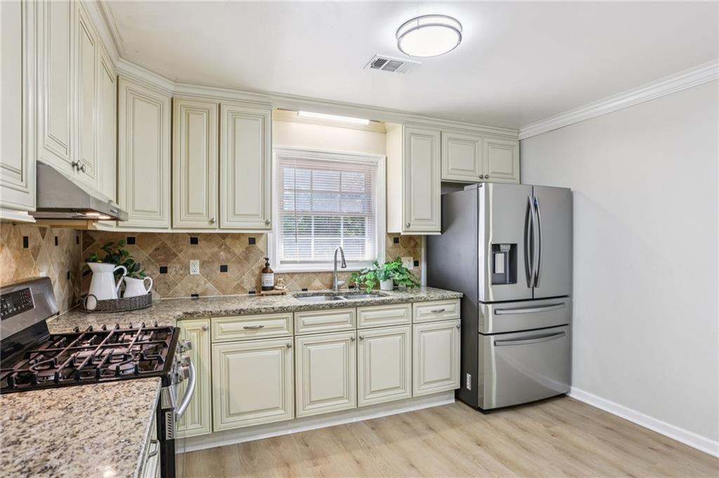 2370 Beaver Creek Road Smyrna, GA 30080 - Photo 2 of 23 a kitchen with stainless steel appliances granite countertop a refrigerator sink and cabinets