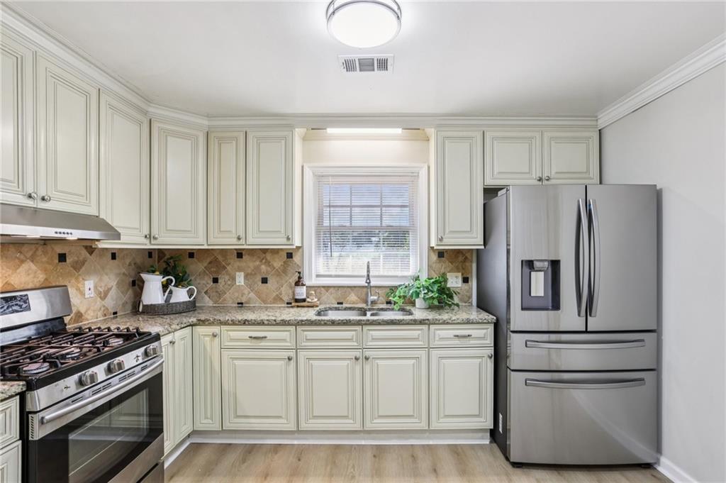 2370 Beaver Creek Road Smyrna, GA 30080 - Photo 9 of 23 a kitchen with stainless steel appliances granite countertop a refrigerator sink and stove