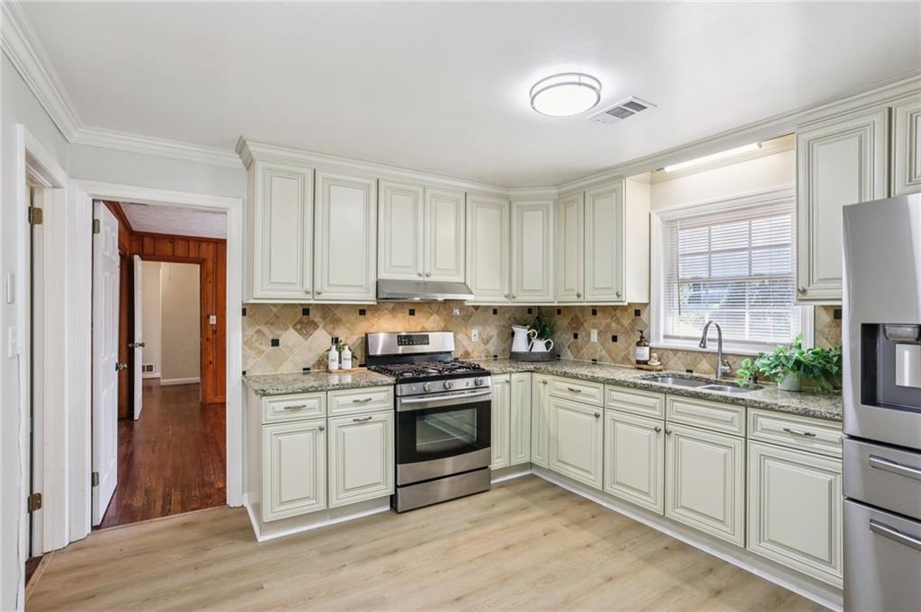2370 Beaver Creek Road Smyrna, GA 30080 - Photo 10 of 23 a kitchen with a sink stove and cabinets