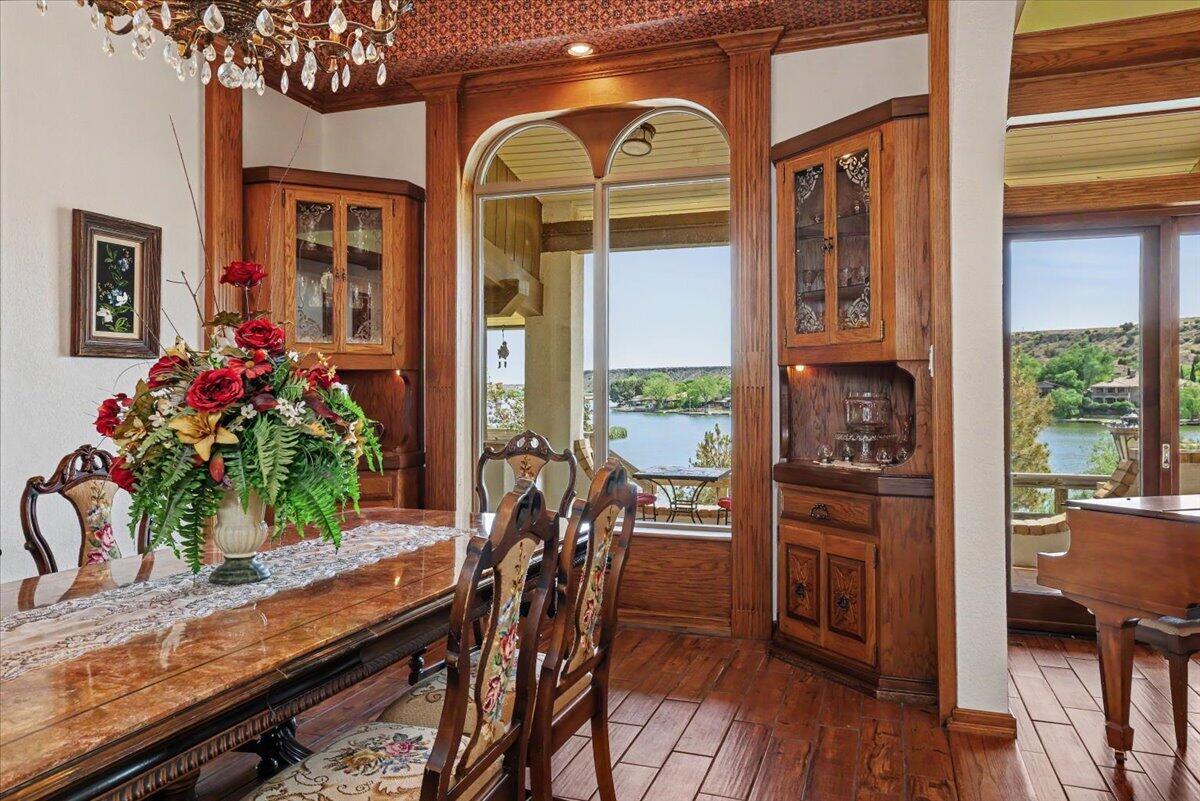 5 West Lakeshore Drive Ransom Canyon, TX 79366 - Photo 13 of 61 a view of a dining room with furniture window and wooden floor