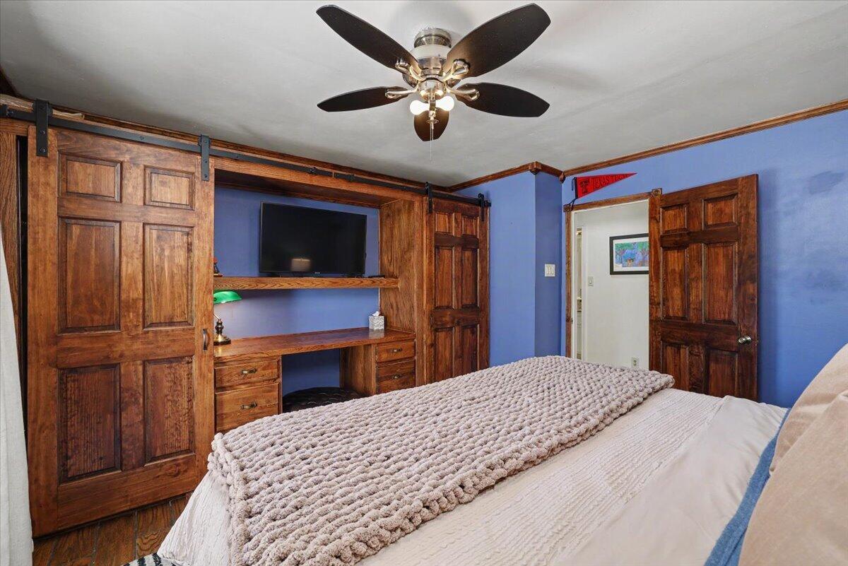 5 West Lakeshore Drive Ransom Canyon, TX 79366 - Photo 15 of 61 a bedroom with a bed and a dresser