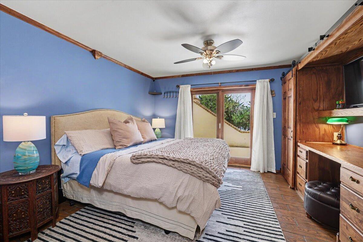 5 West Lakeshore Drive Ransom Canyon, TX 79366 - Photo 16 of 61 a bedroom with a large bed and a window